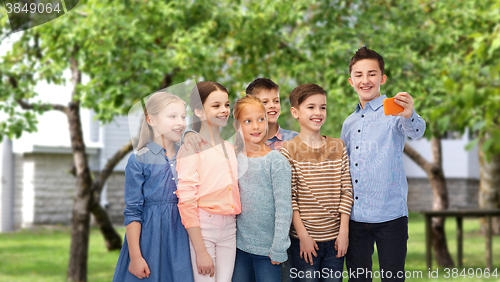 Image of happy children talking selfie by smartphone