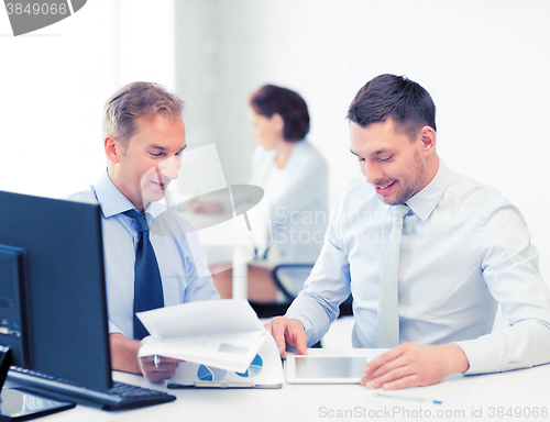 Image of businessmen with notebook and tablet pc