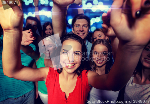 Image of smiling women dancing in club