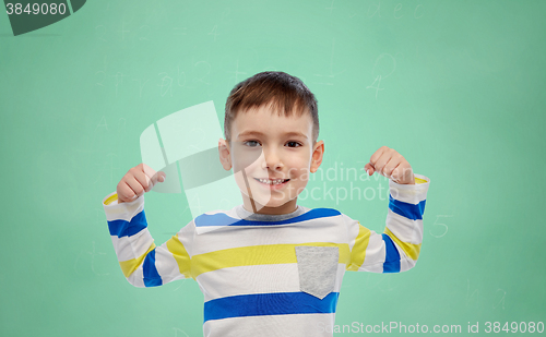 Image of happy smiling little boy with raised hand