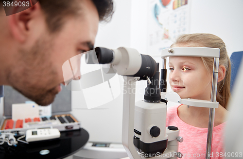 Image of optician with tonometer and patient at eye clinic