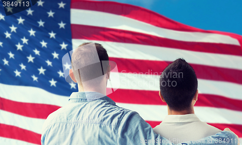 Image of close up of happy male gay couple hugging
