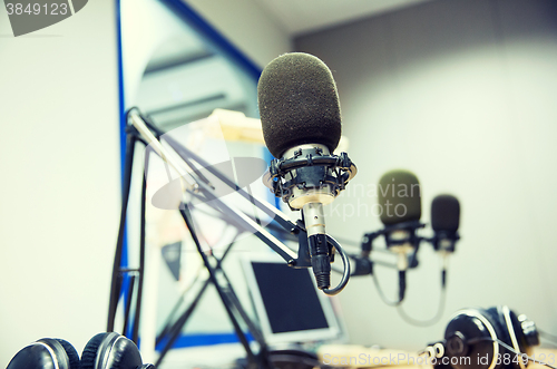 Image of microphone at recording studio or radio station