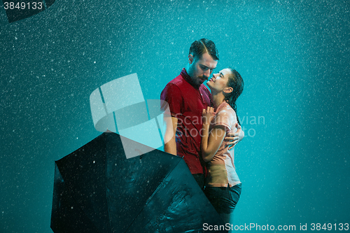 Image of The loving couple in the rain