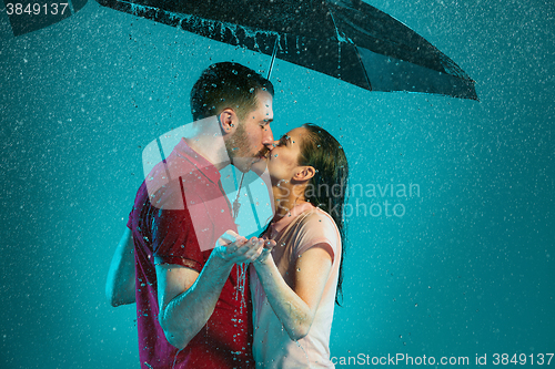 Image of The loving couple in the rain