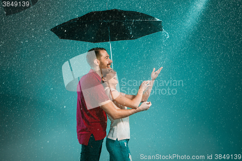 Image of The loving couple in the rain