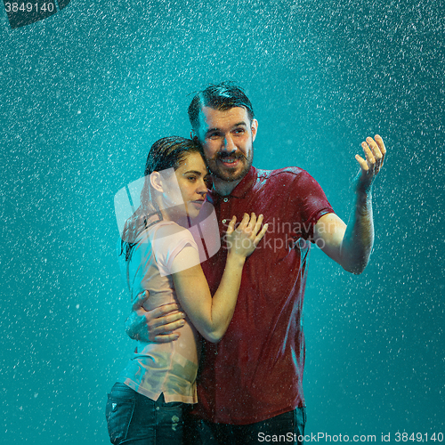 Image of The loving couple in the rain