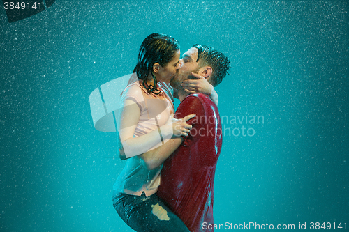 Image of The loving couple in the rain