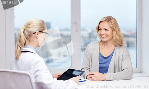 Image of doctor with tablet pc and woman at hospital