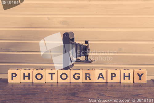 Image of Vintage camera on a photography sign