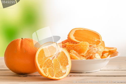 Image of Oranges on a wooden table