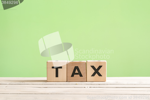 Image of Tax sign on a green background