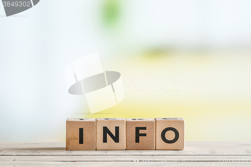 Image of Info sign made of wooden cubes