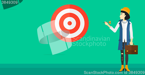 Image of Business woman with target board.