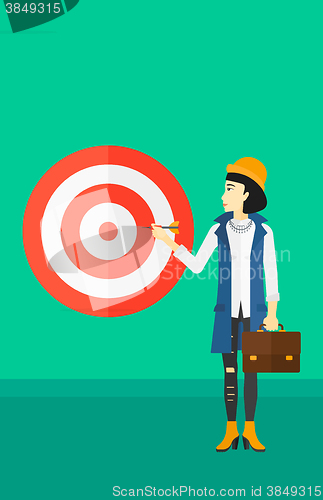 Image of Business woman with target board.