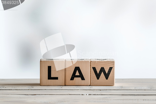 Image of Law sign on a wooden desk