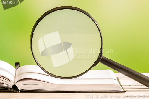 Image of Magnifying glass on an open book