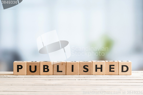 Image of Published sign on a wooden table