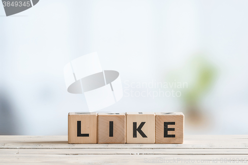 Image of Like message on a wooden desk