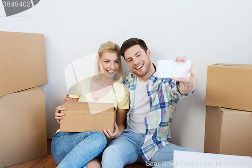 Image of couple with taking smartphone selfie and moving