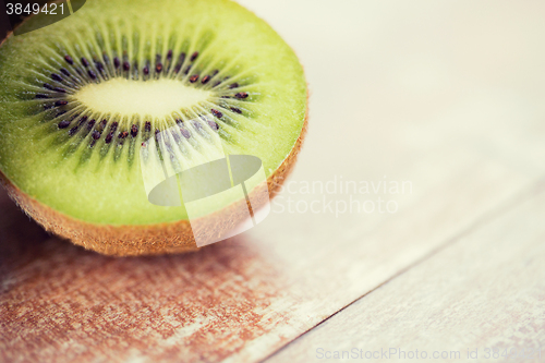 Image of close up of ripe kiwi slice on table