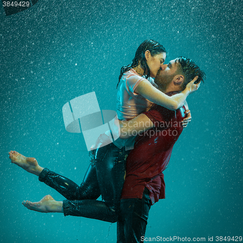 Image of The loving couple in the rain