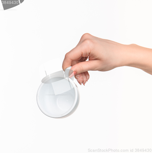 Image of Woman hand with cup on white background