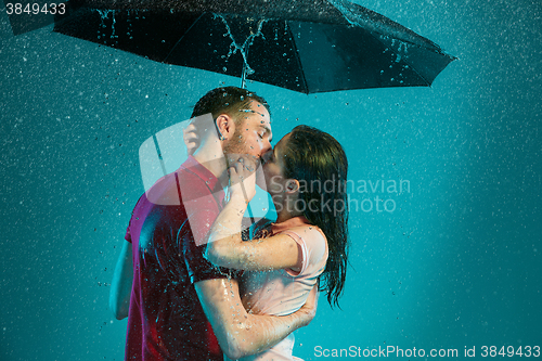 Image of The loving couple in the rain