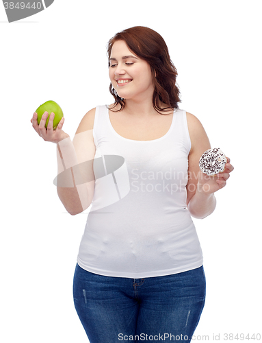 Image of happy plus size woman choosing apple or cookie