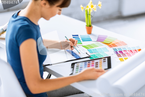 Image of woman working with color samples for selection