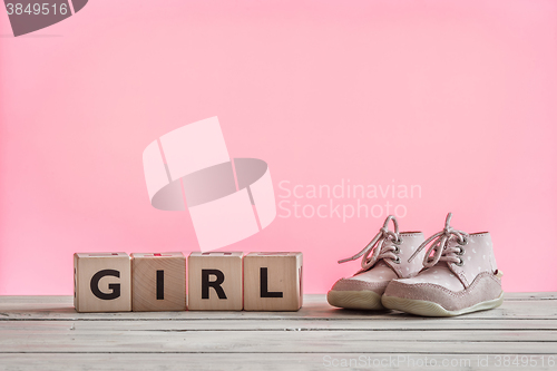 Image of Baby girl shoes on a table