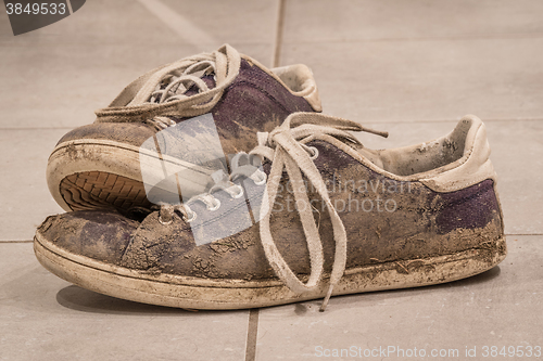 Image of Dirty shoes with mud and soil