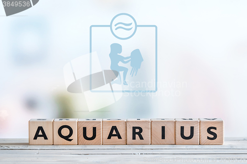 Image of Aquarius star sign on a table