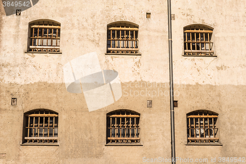 Image of Jail wall with windows with bars