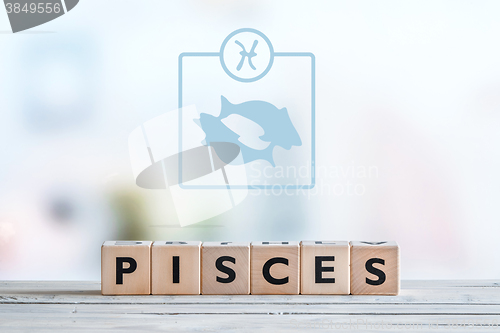 Image of Pisces star sign on a table