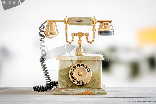 Image of Antique telephone in gold and marble