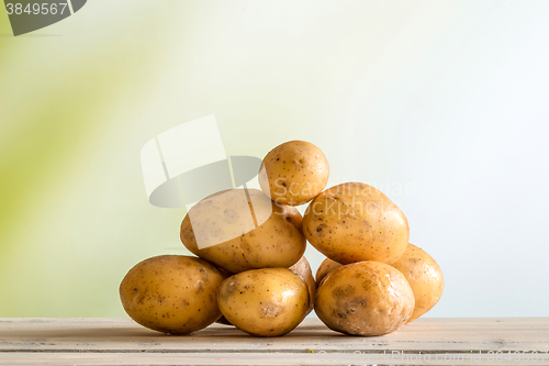 Image of Potatoes on a wooden table