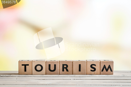 Image of Tourism sign on a wooden desk