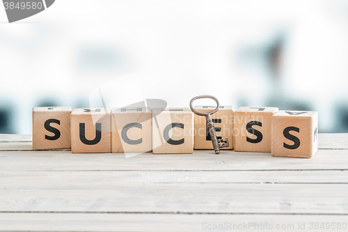 Image of The word success with a key