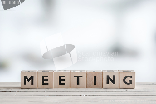 Image of Meeting sign on an office desk