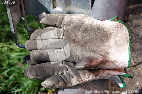 Image of dirty leather gloves,white