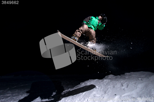 Image of snowboarder jumping