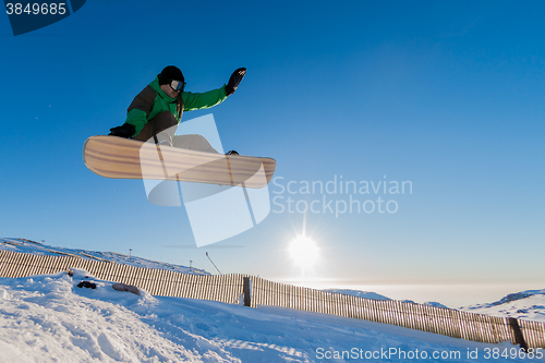 Image of Snowboarder at jump