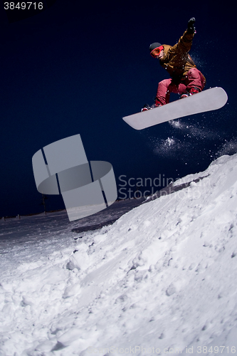 Image of Snowboarder jumping