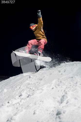 Image of Snowboarder jumping