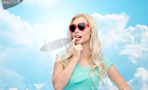 Image of happy young blonde woman or teenager in sunglasses