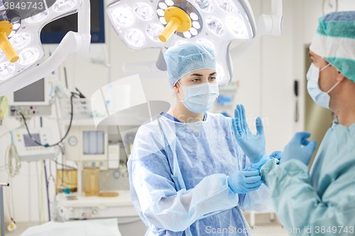 Image of surgeons in operating room at hospital