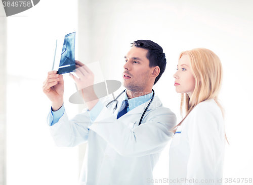 Image of two doctors looking at x-ray