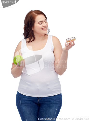 Image of happy plus size woman choosing apple or cookie