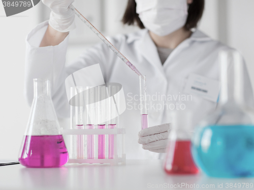 Image of close up of scientist making test in lab